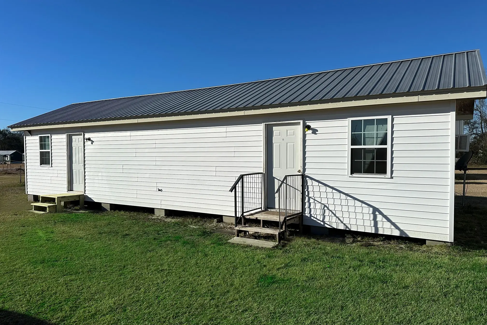Furnished rental cabin with metal roof and private entrances at Vogtle Ranch